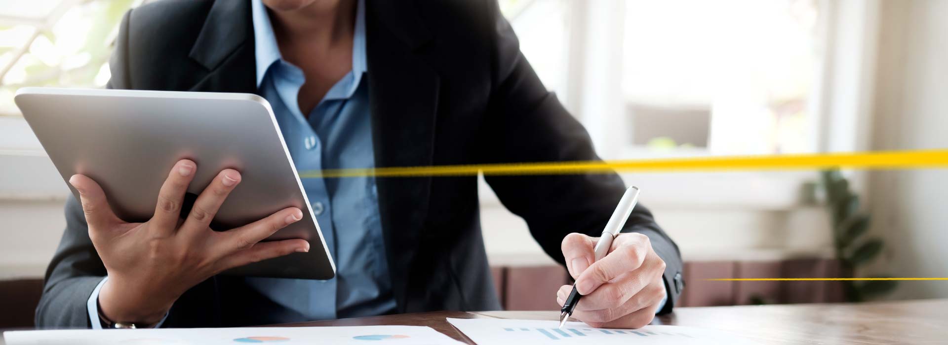 LGI specialist at desk with tablet